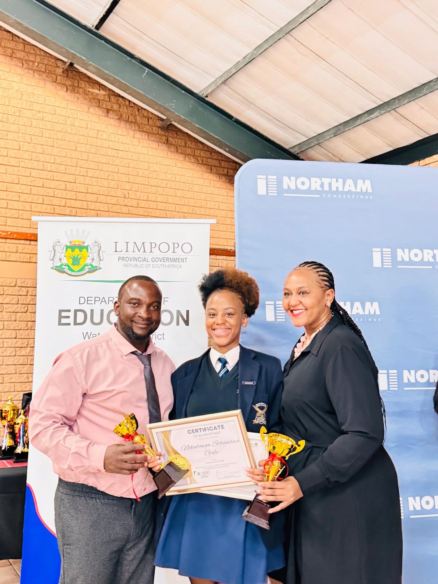 Advanced College learner receiving an award at a recognition event