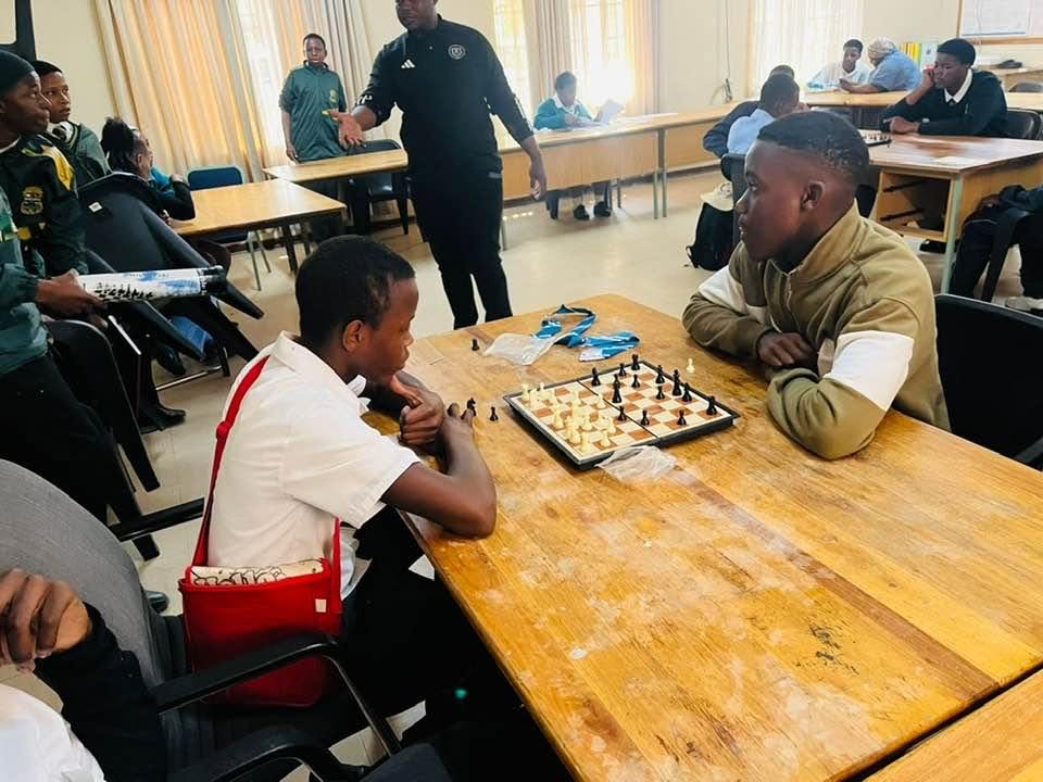 Advanced College learners taking part in a chess activity