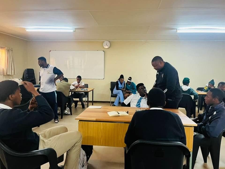 Advanced College learners gathered in a classroom
