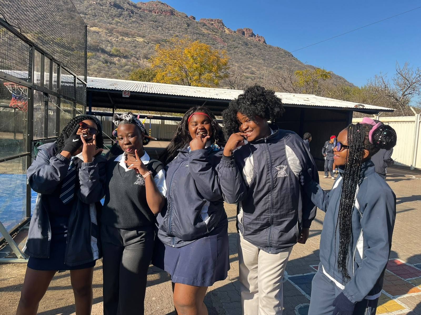 Advanced College learners together on an outdoor court