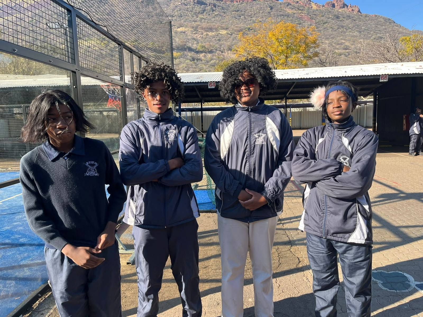 Advanced College learners standing together outdoors