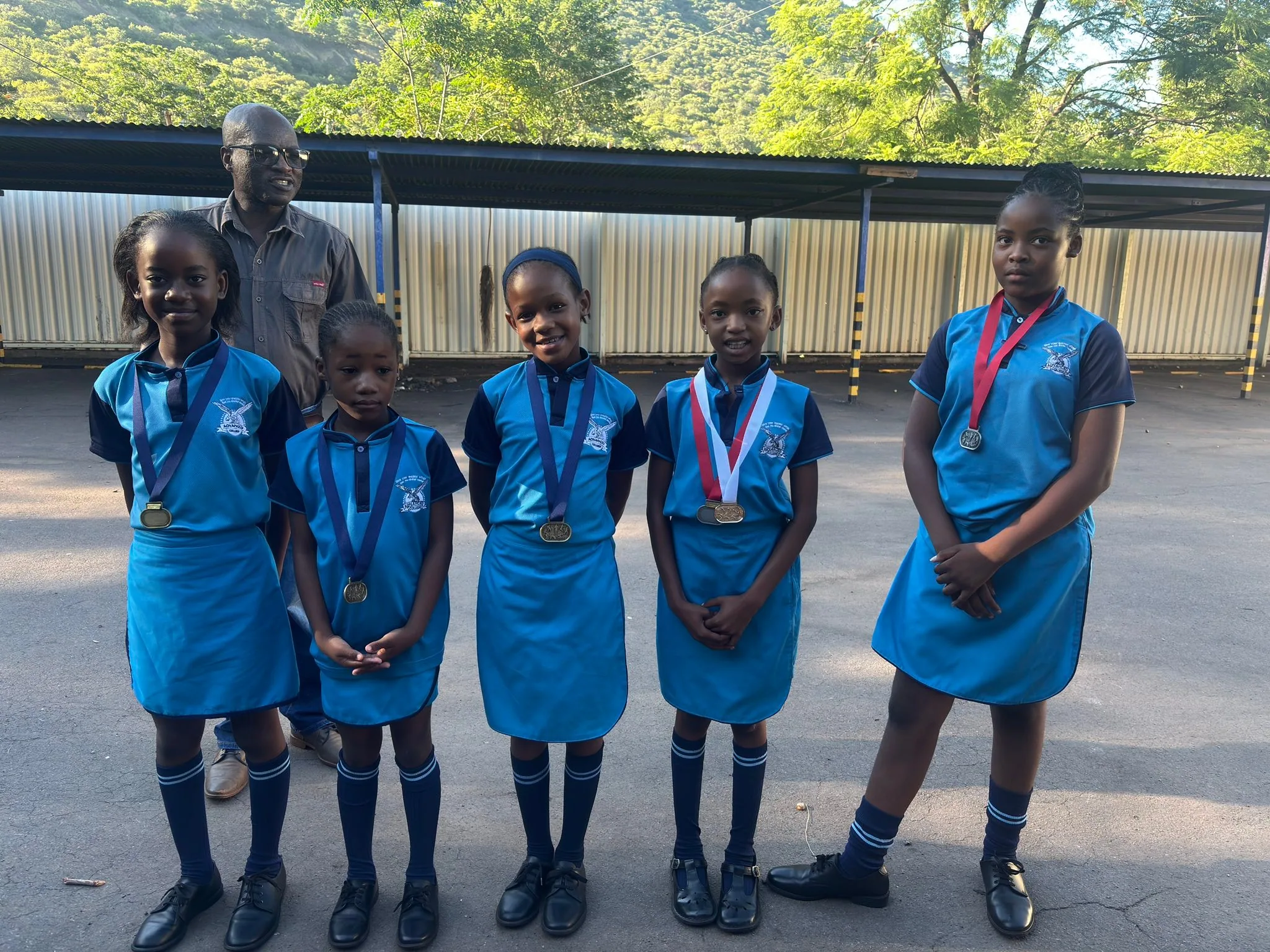 Advanced College learners receiving medals for sporting achievement
